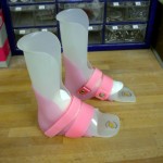 Pair of pediatric orthoses with pink straps