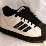 Athletic shoe with a custom orthotic insert