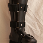 Tall black orthopedic boot with straps
