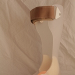 Plastic ankle foot orthosis with tan strap