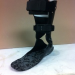 Carbon fiber ankle foot orthosis in a shoe